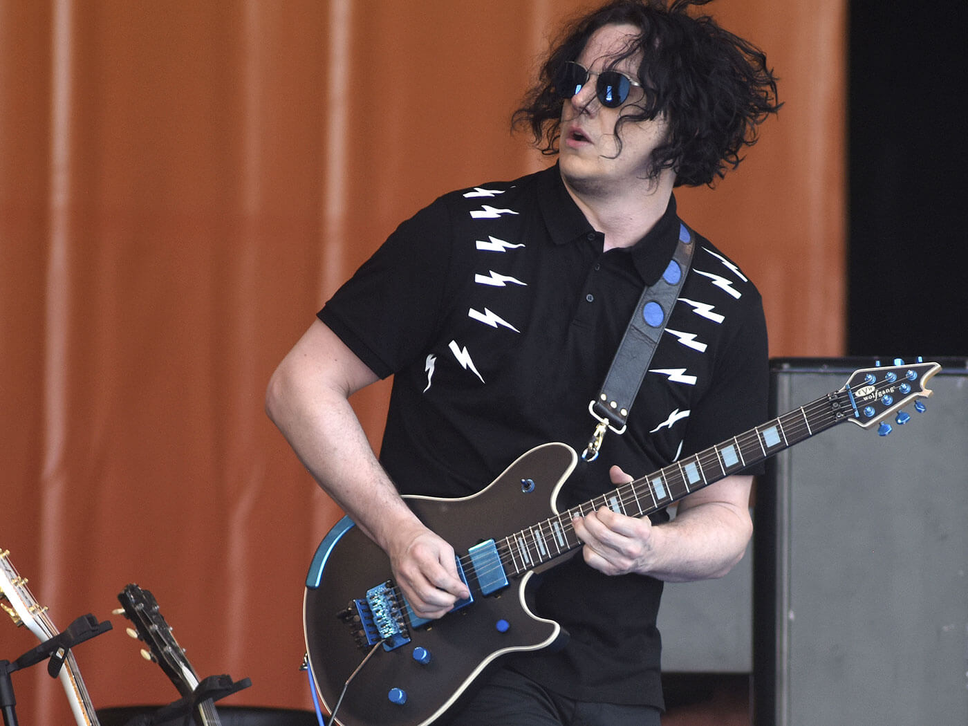 Jack White playing his guitar in an event 
