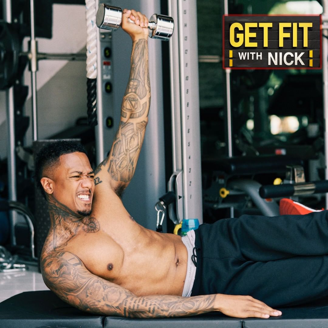 Nick Cannon doing a floor exercise with a dumbbell, with the words ‘Get fit with Nick’