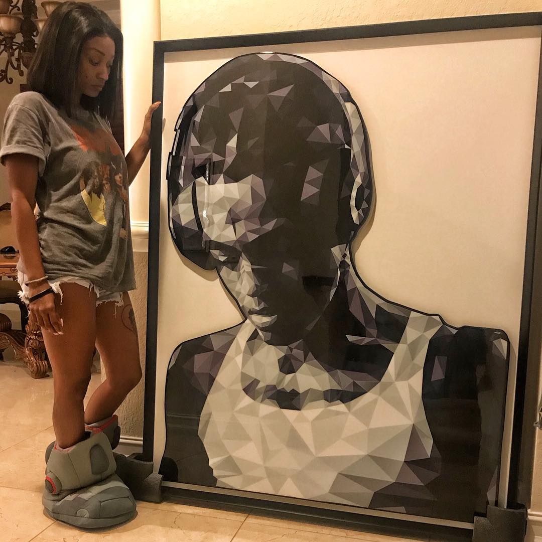 Cleopatra Bernard in her Parkland mansion looks down at a giant framed artist’s black and white rendition of XXXTentacion