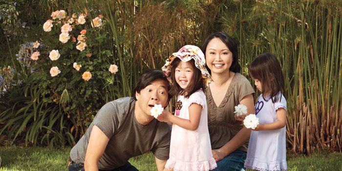 Tran Jeong ad Ken Jeong with their twins in what seemed like a garden