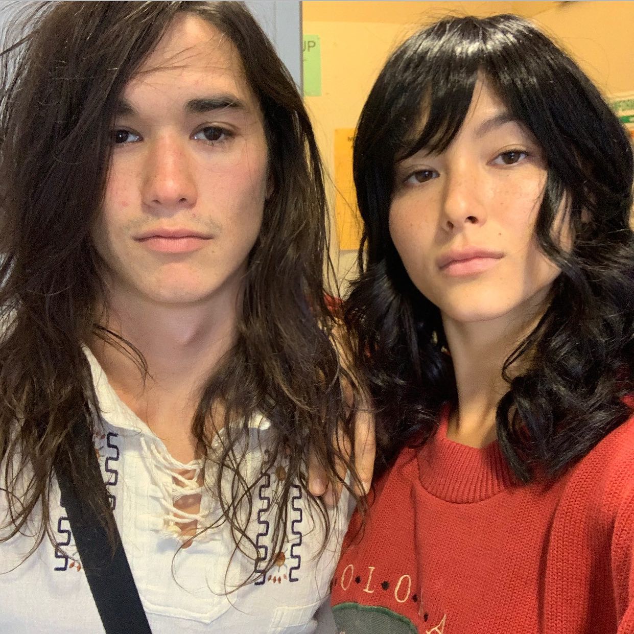 Fivel Stewart in red sweatshirt with long-haired brother Booboo Stewart