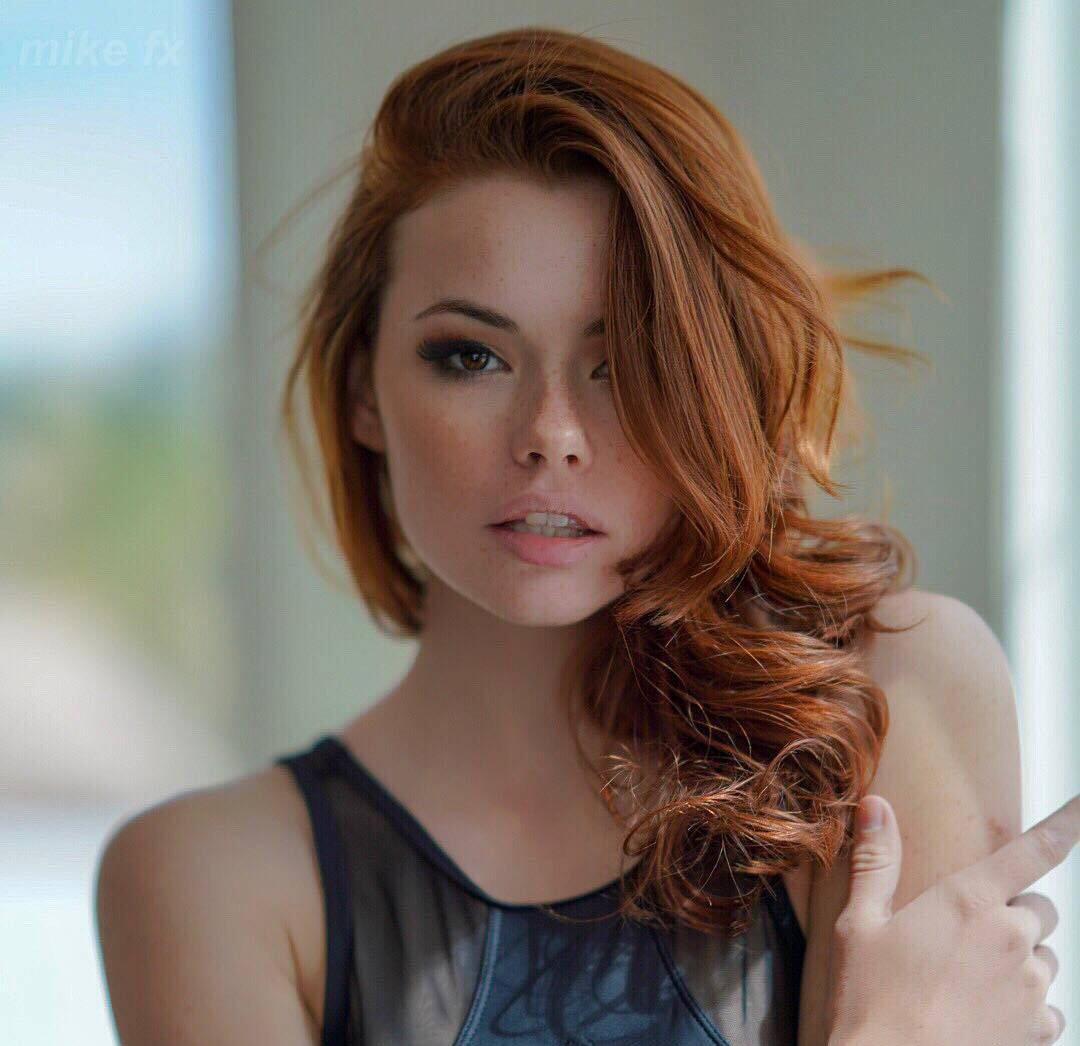 Sabrina lynn with her hair on one side of her shoulder