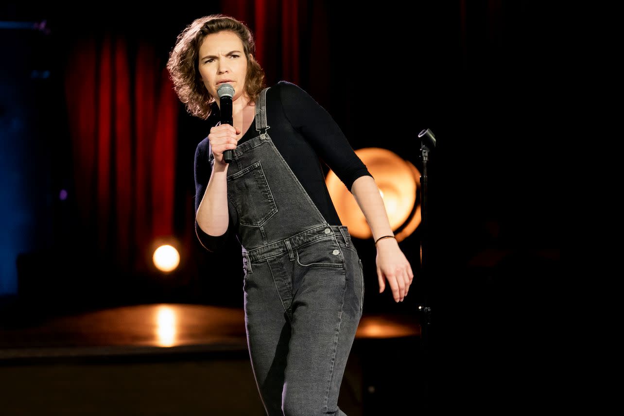 Beth Stelling wearing a jumpsuit while performing for Girl Daddy live show