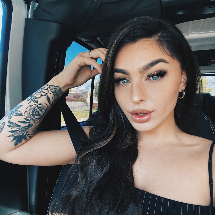Emily Rinaudo in her car with her hair down