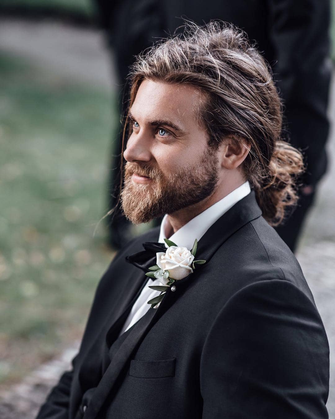 Brock O'Hurn wearing a suit at his best friend's wedding