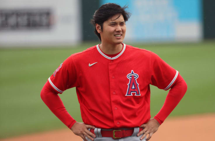 Shohei Ohtani in red posing in post-match ceremony