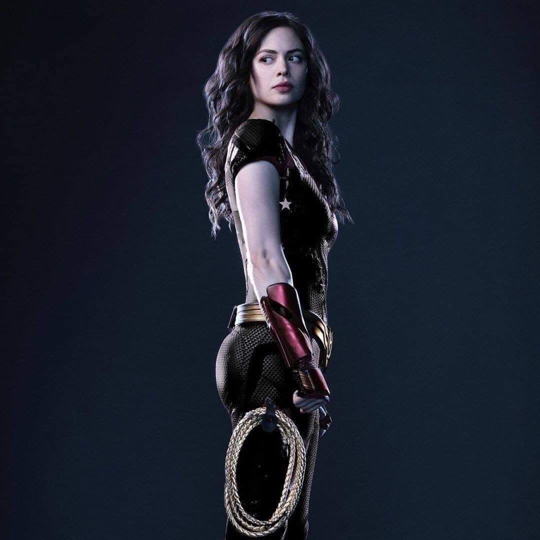 Conor Leslie in her costume as Wonder Girl, with a lasso attached on her right leg