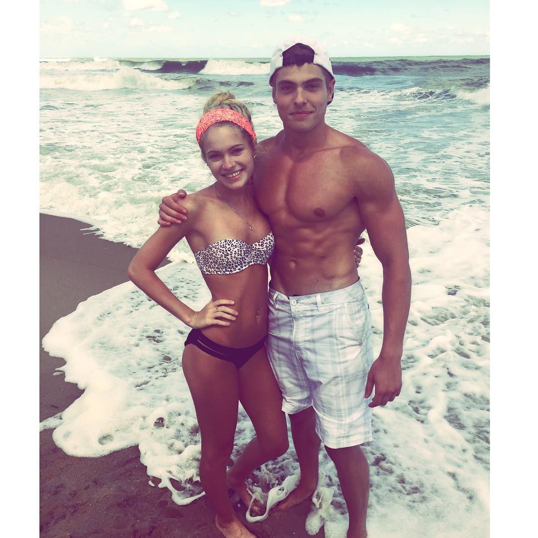 Claudia Walsh with her Boyfriend in the beach beside rock formation