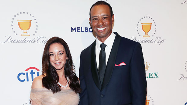 Erica Herman wearing a cream dress And Tiger Woods wearing a black tuxedo