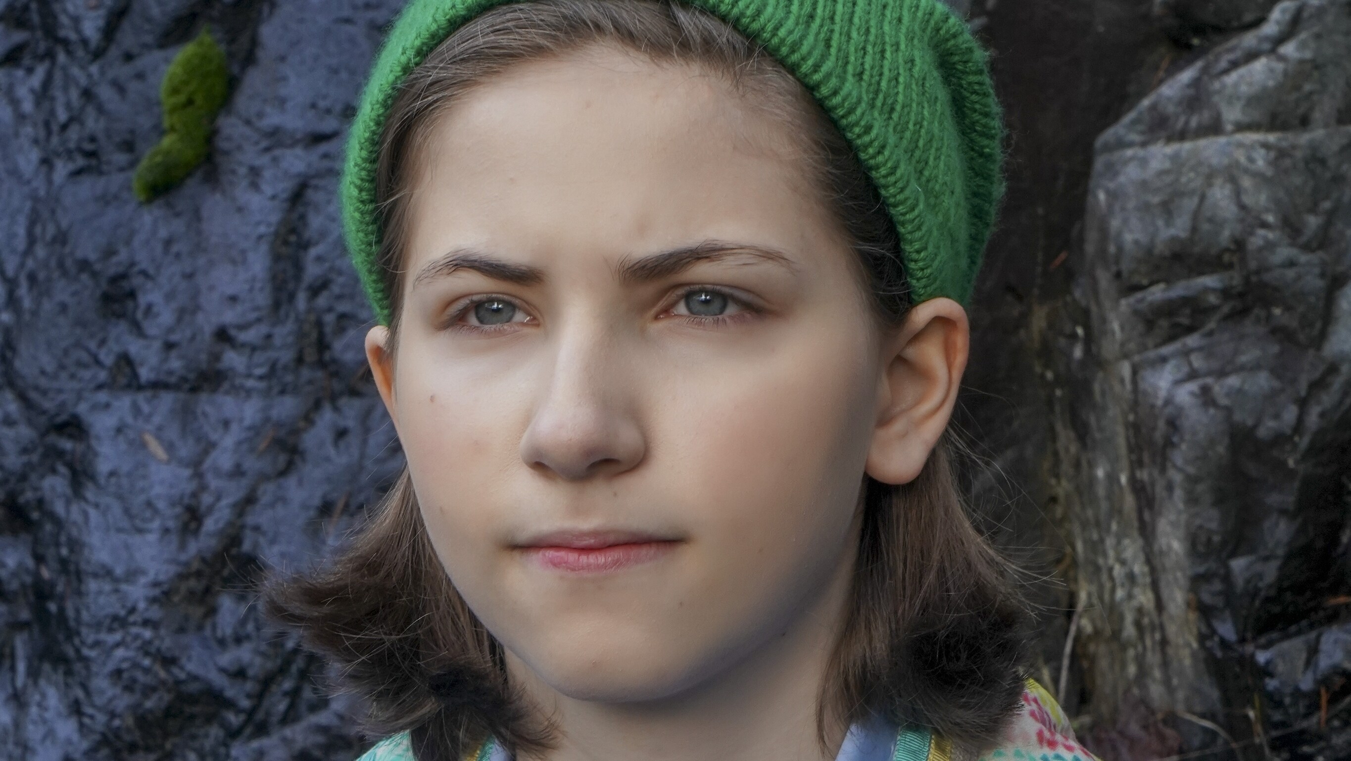 Emmy Deoliveira wearing a green beanie while playing a role in The Mysterious Benedict Society movie