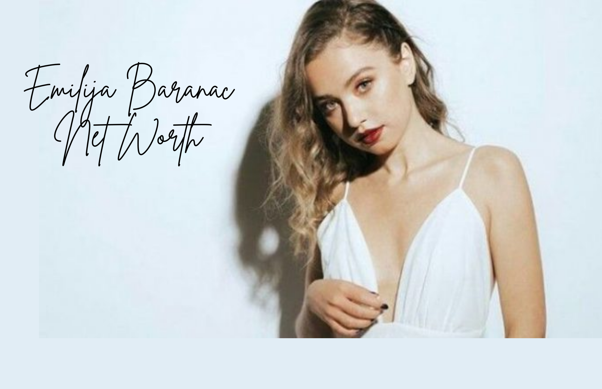 Emilija-baranac wearing white dress and red lips with her hair down
