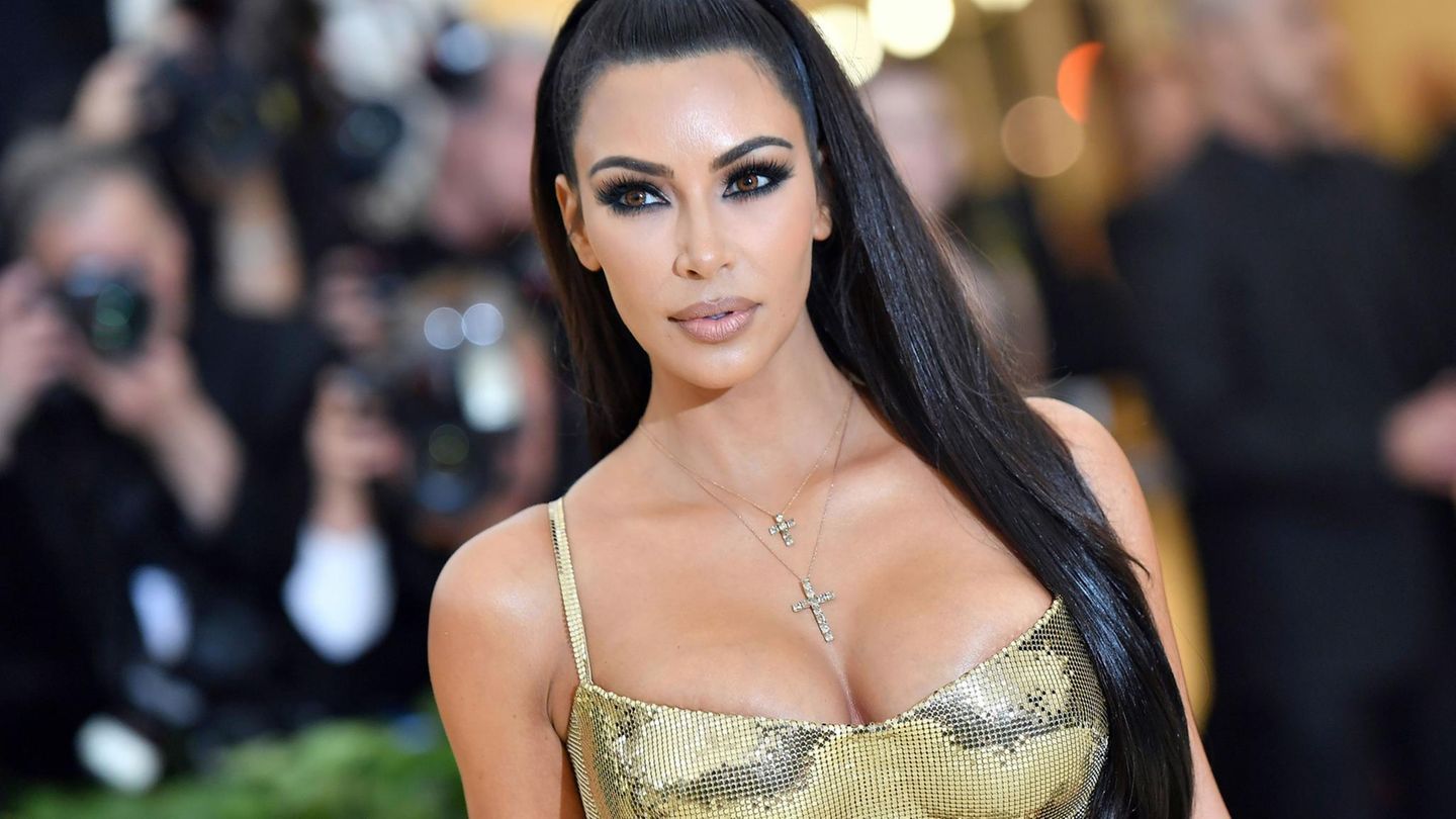 Kim Kardashian in a spaghetti Strap golden dress