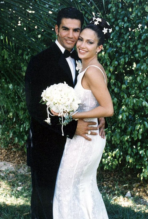Ojani Noa standing with Jennifer Lopez in the wedding dress
