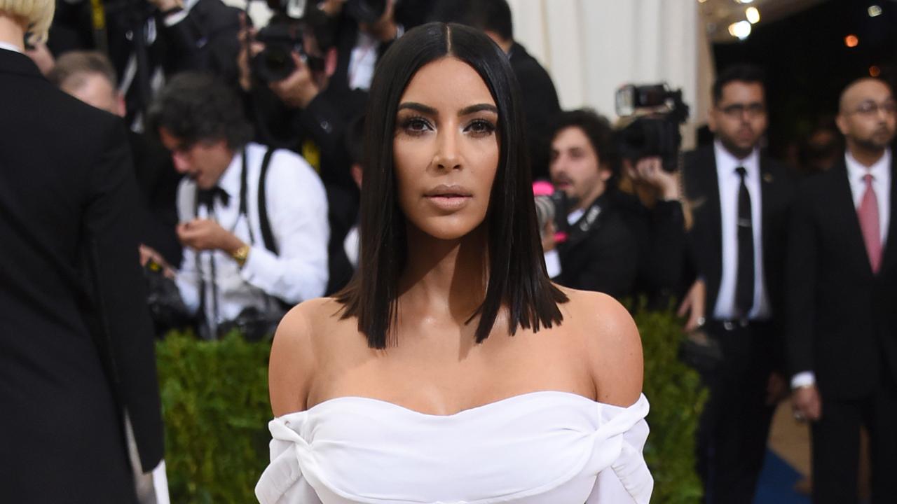 Kim Kardashian in a white off-shoulder dress