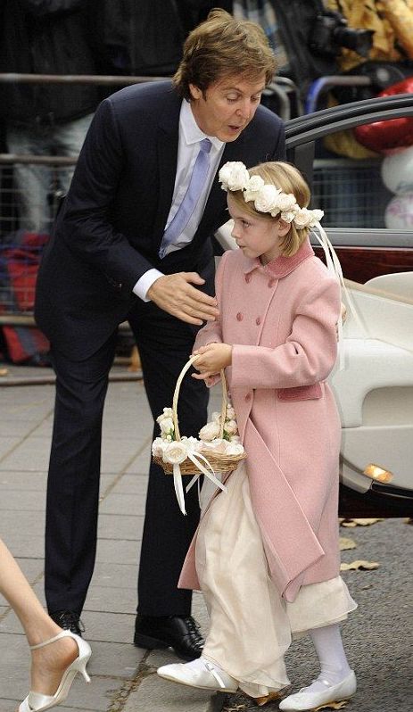 Beatrice Mccartney with her father Paul wearing formal attire