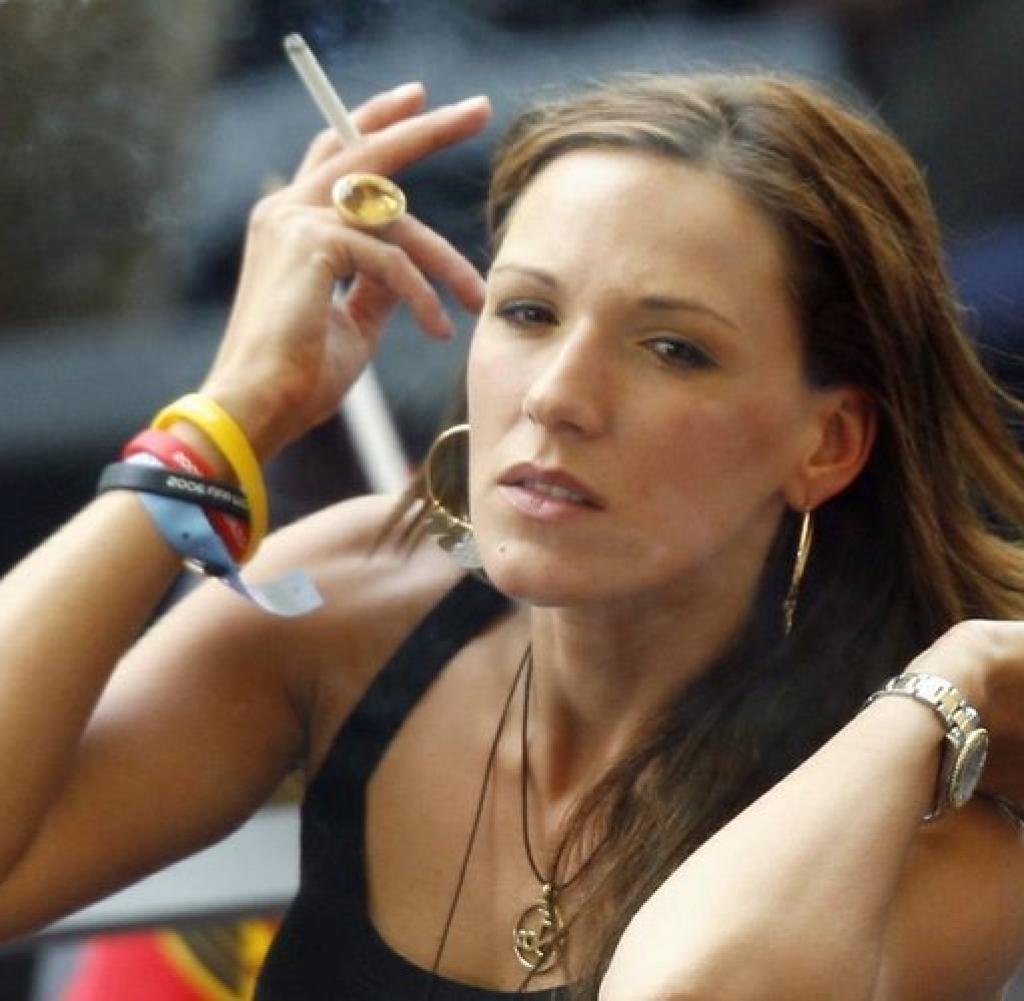 Simone Lambe posing a smoker holding cigarette in her hand