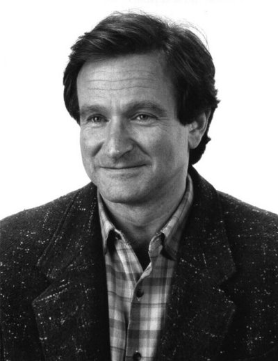 Robin Williams in a coat and a flannel shirt