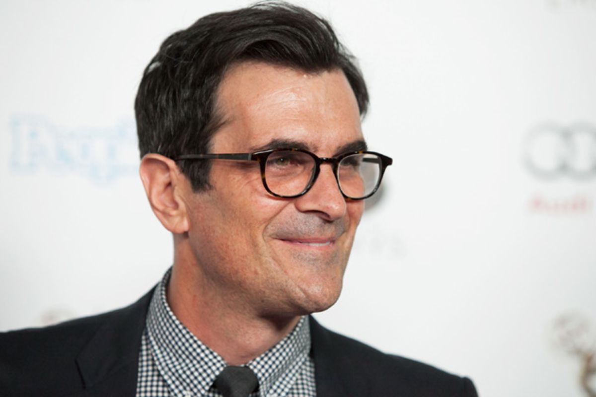 Ty Burrell in an eye glasses and black coat