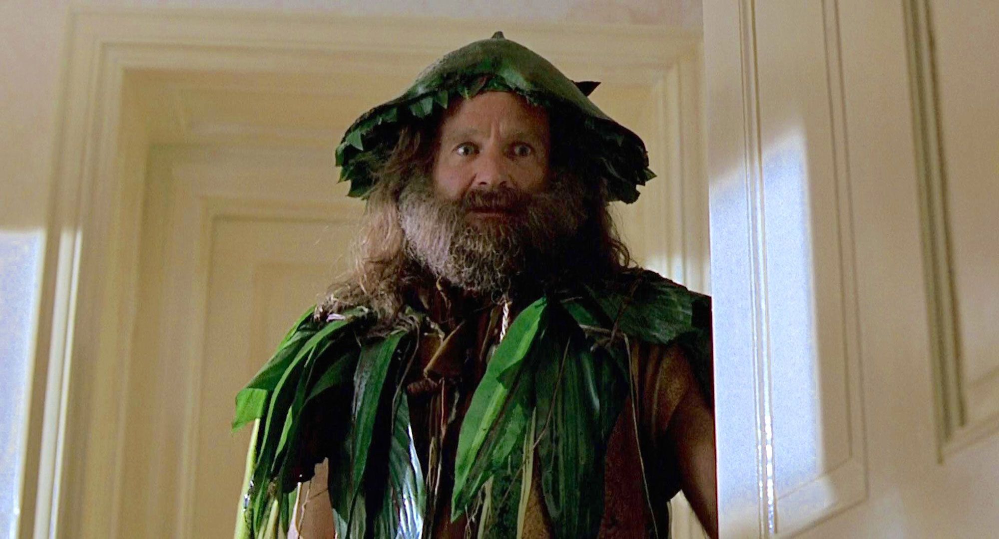 Robin Williams in green leave costume and big beard