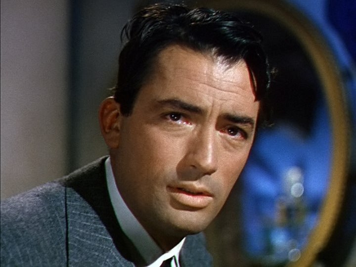 Gregory Peck at a young age wearing a coat