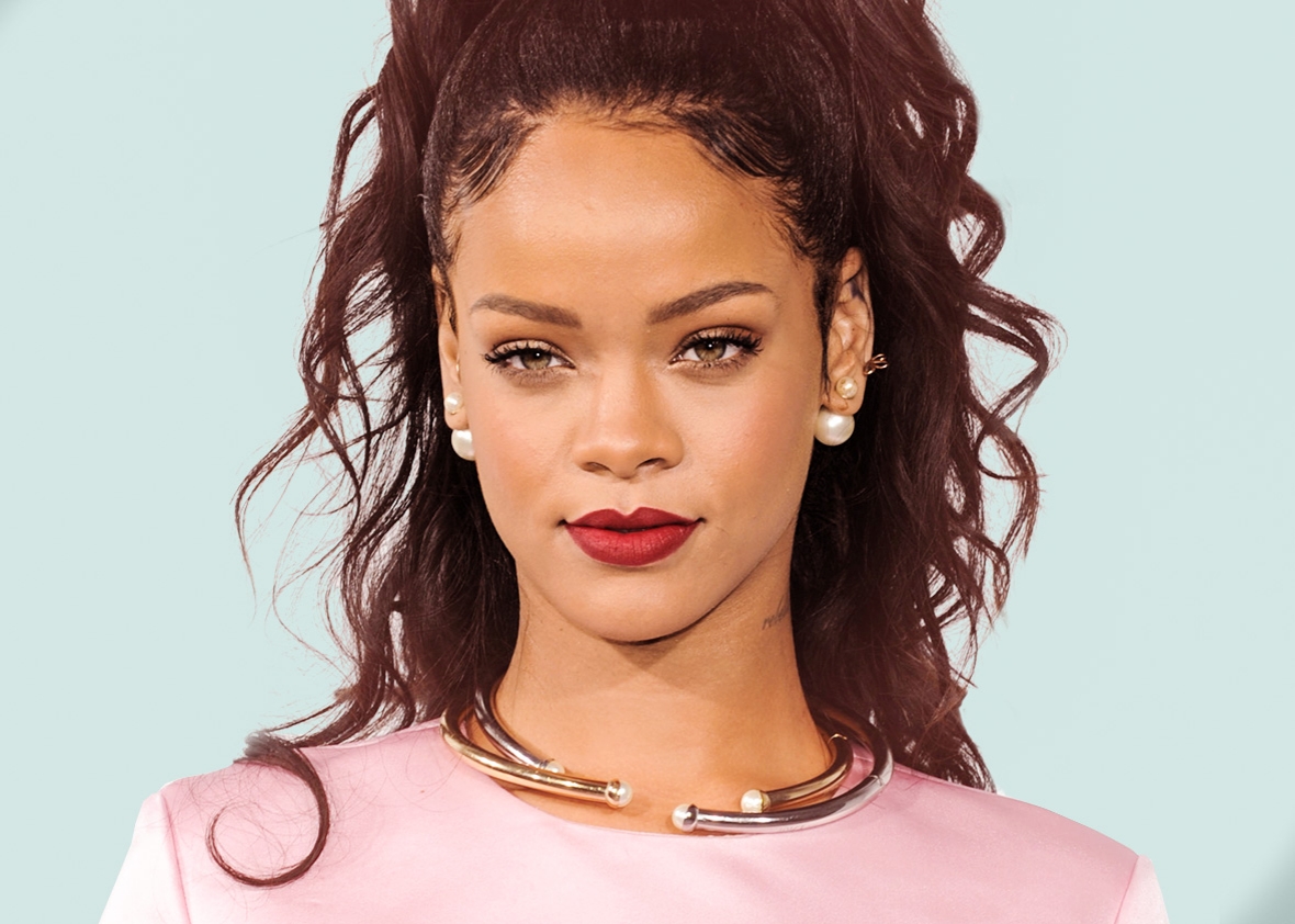 Rihanna Is Dressed In A Pink Outfit With A Beautiful Silver Necklace And Double-Sided Pearl Earrings