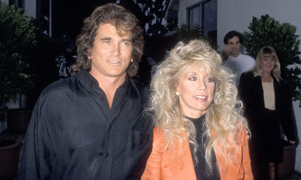 Cindy Landon with husband wearing an orange jacket