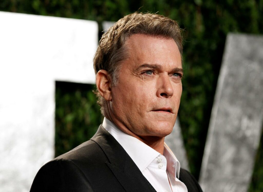 Ray Liotta wearing a suit in an event