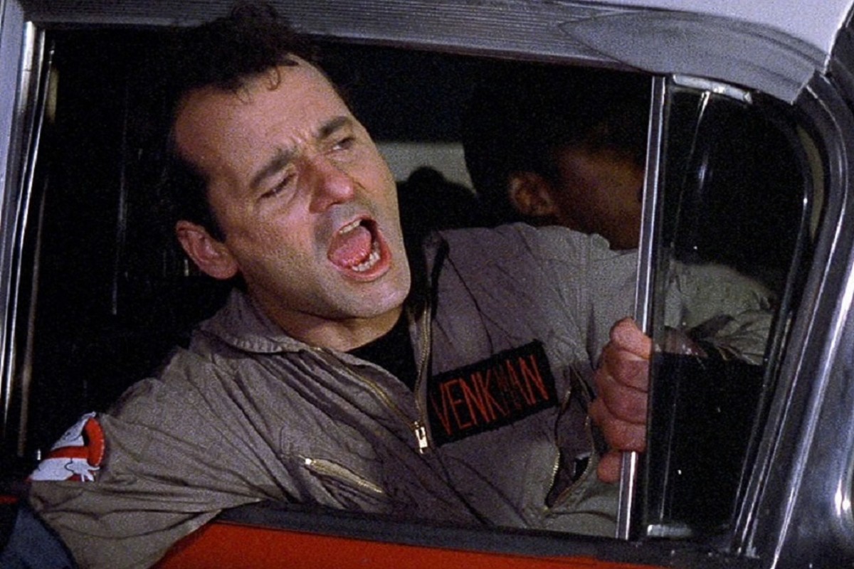 Shouting Bill Murray in a ghostbusters suit inside a car