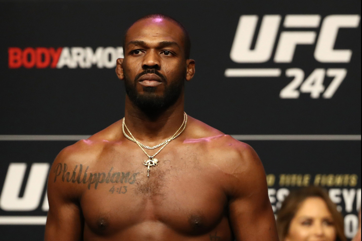 Shirtless Jon Jones with gold necklaces