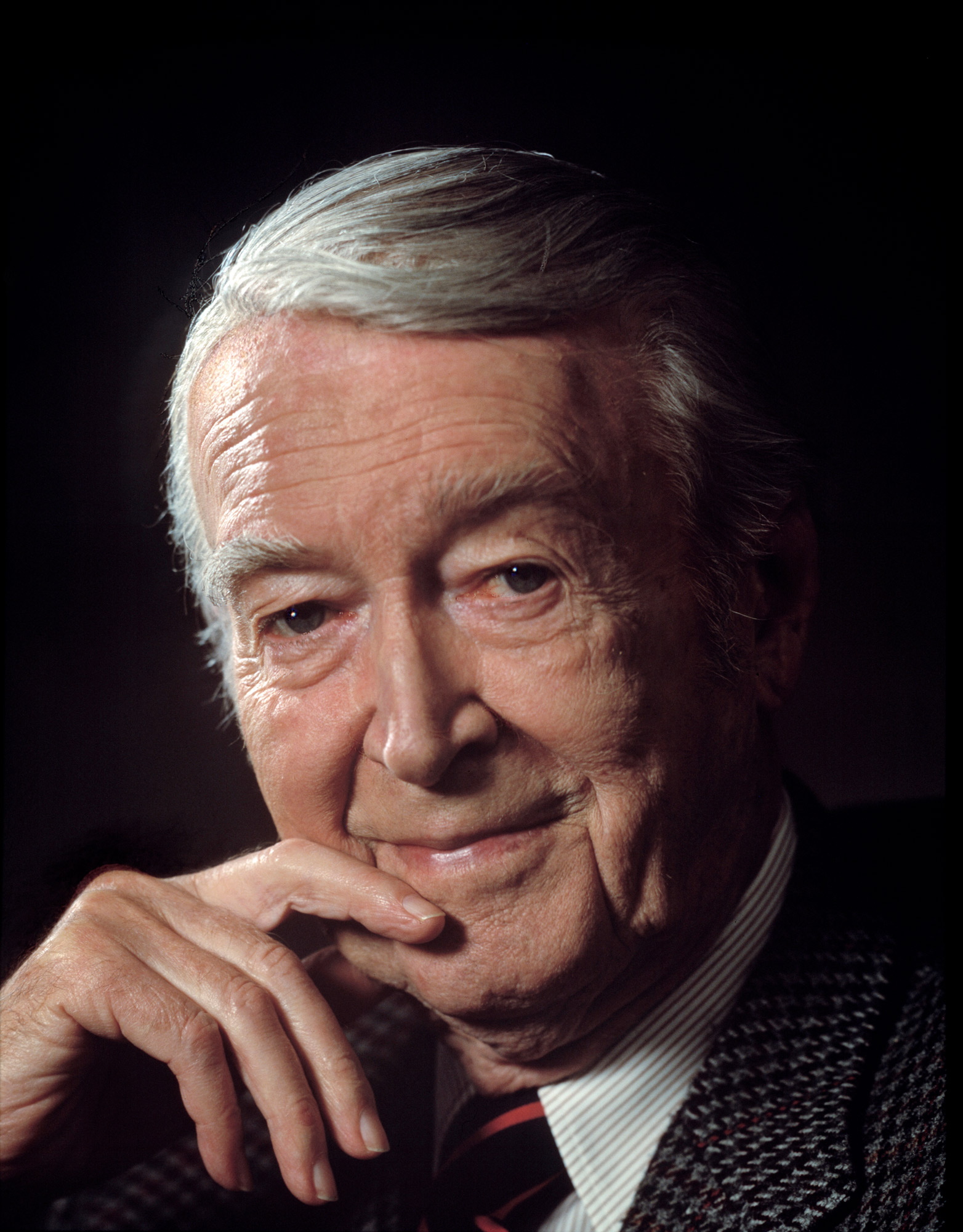 James Stewart at an old age with his hand on his chin