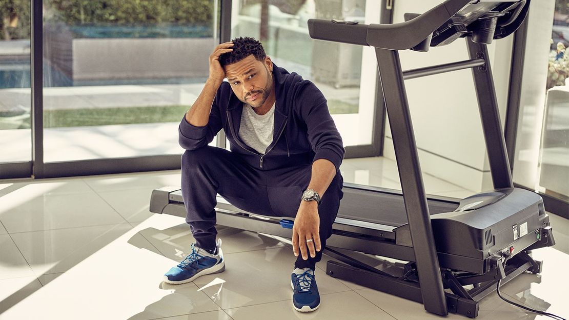 Anthony Anderson, Wearing A Blue Track Suit, Sitting On His Treadmill 