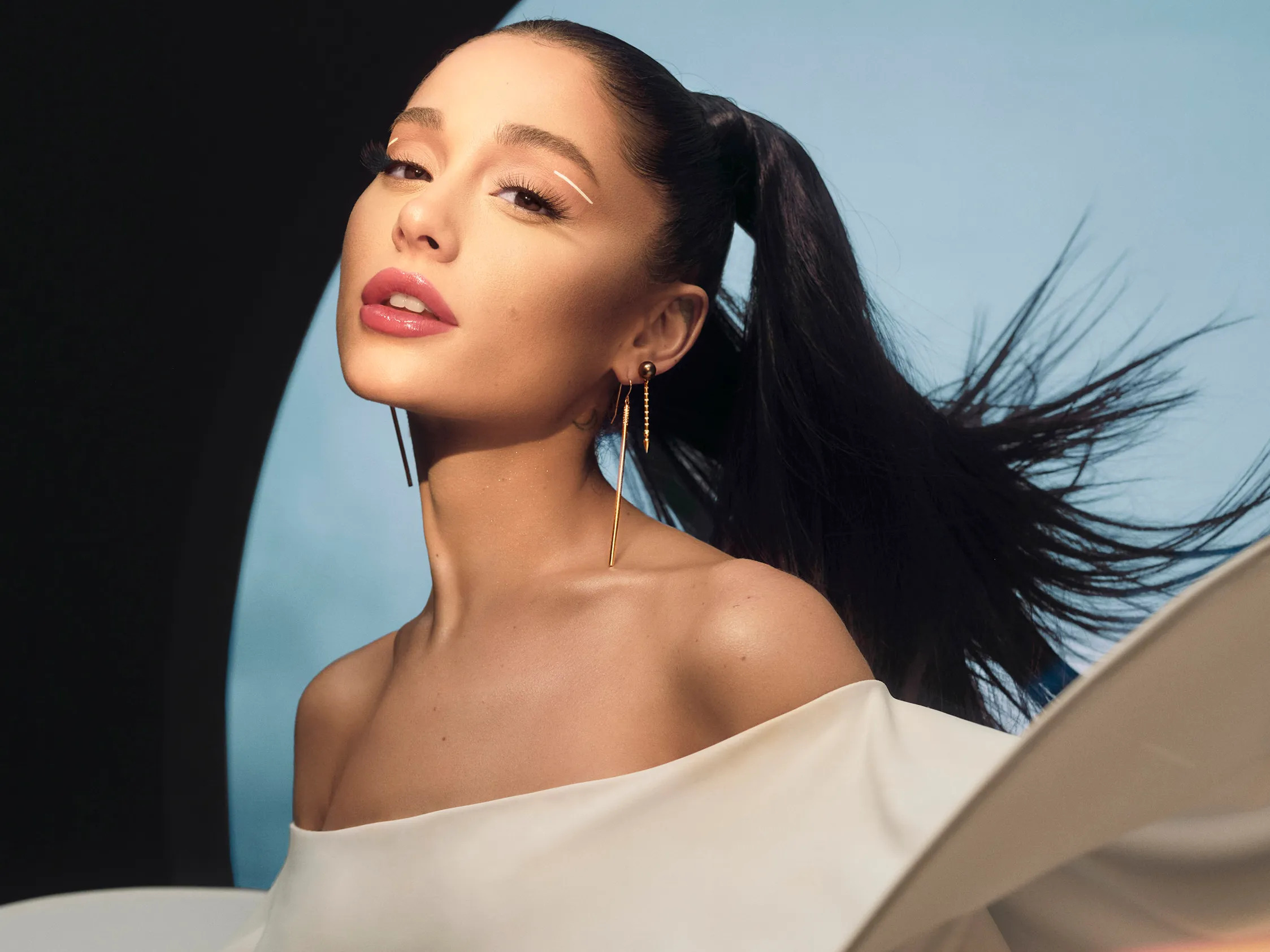 Ariana Grande wearing a white dress on the cover of Allure