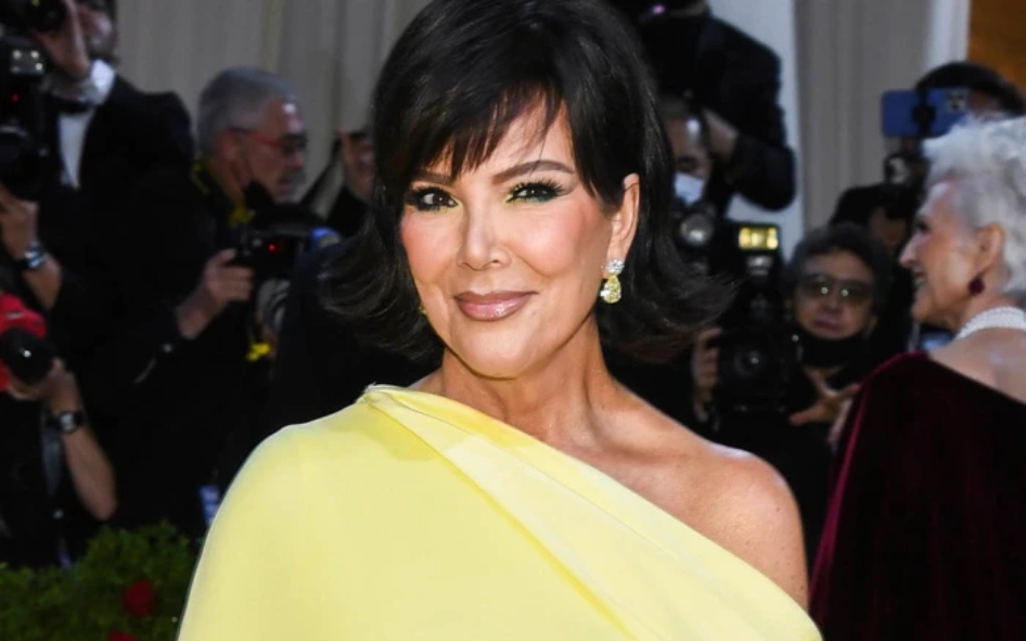 Kris Jenner wearing a yellow dress