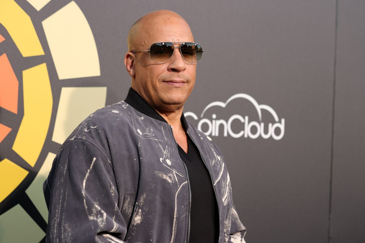 Vin Diesel wearing shades while wearing a jacket