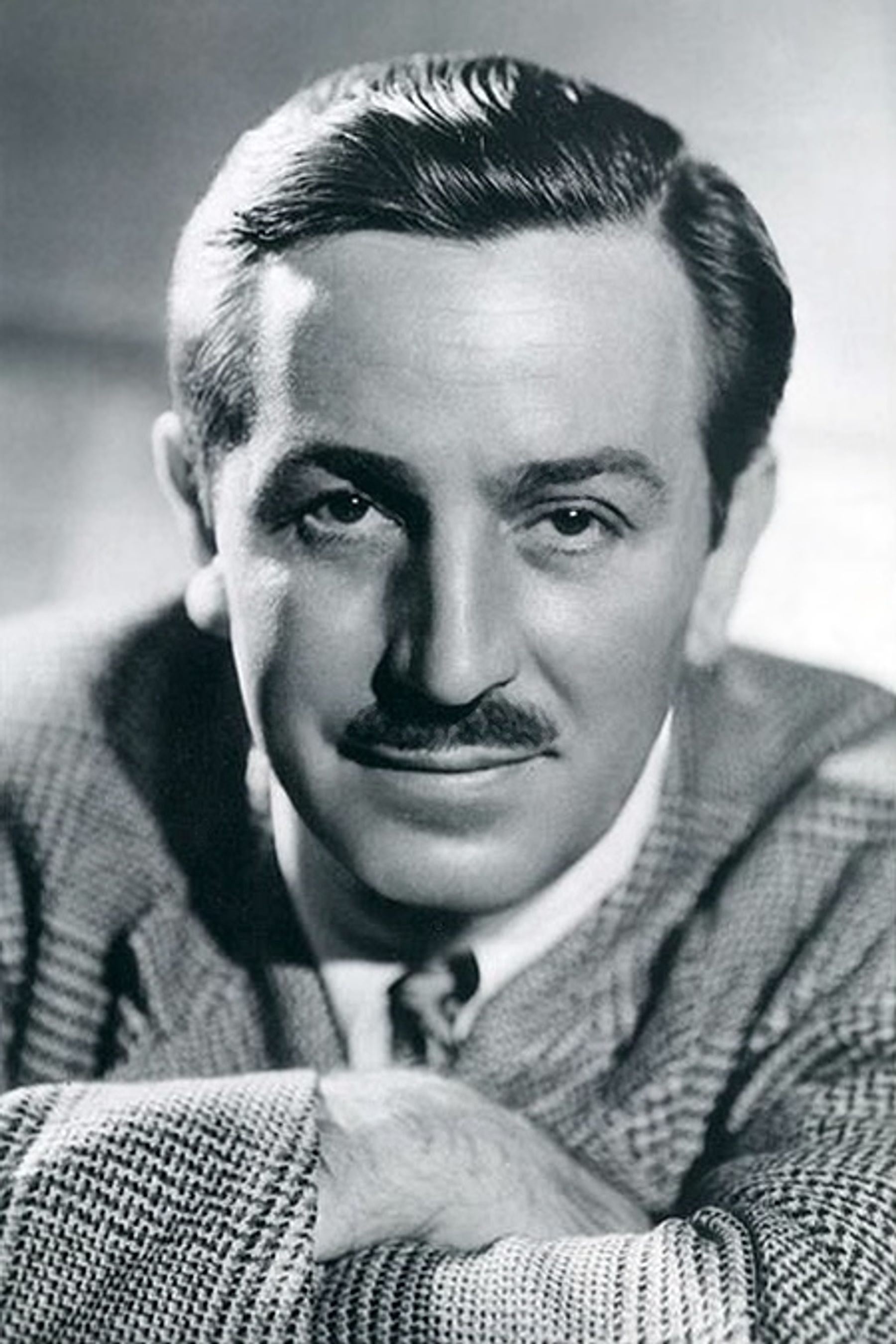 A black-and-white headshot of Walt Disney