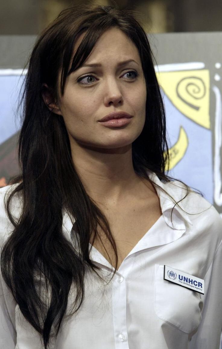 Angelina Jolie wearing a white blouse with no makeup at UNHCR event