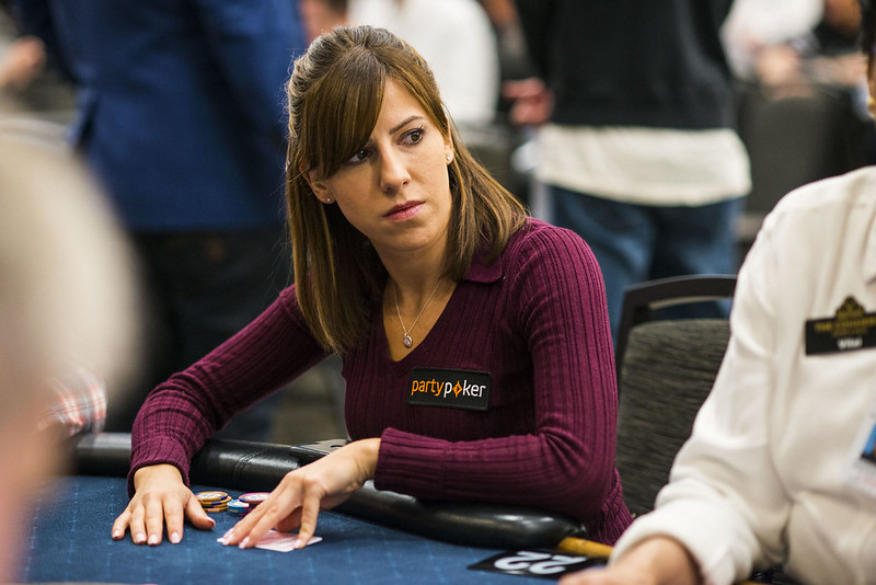 Kristen Bicknell wearing a purple sweater while playing poker