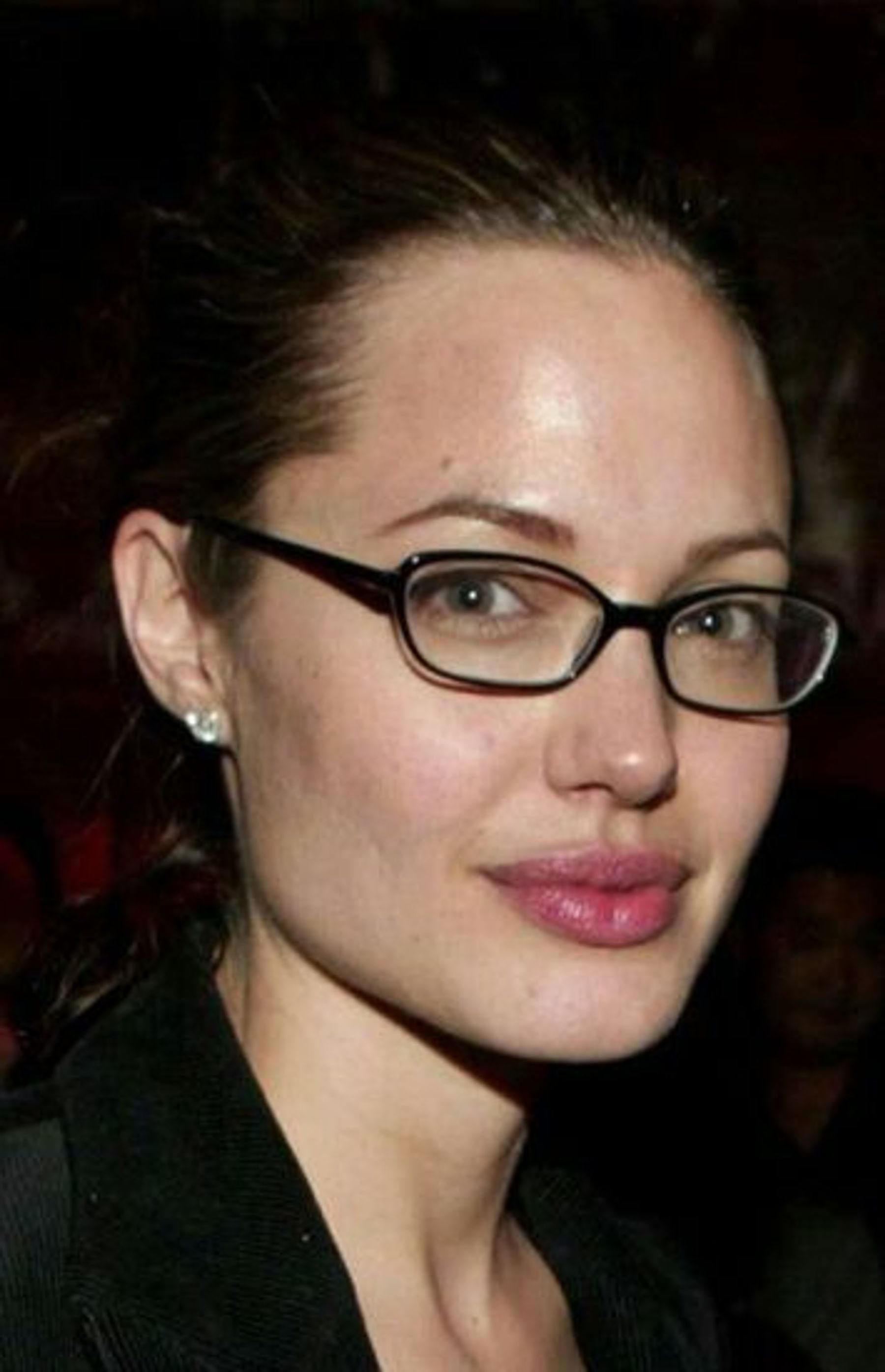 Angelina Jolie wearing eyeglasses with no makeup on