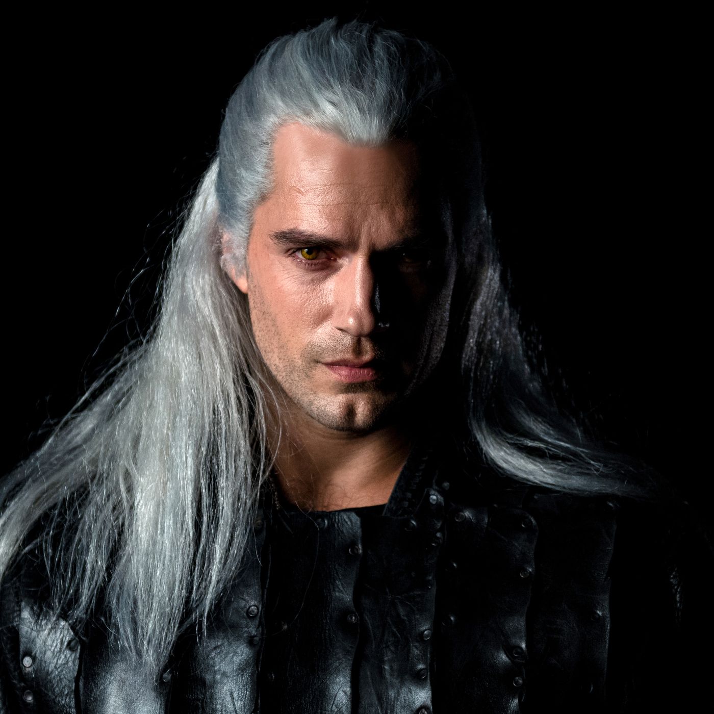 Henry Cavill as Geralt of Rivia with silver hair and color almond eyes