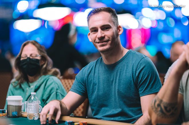 Justin Bonomo wearing a green tshirt while playing poker