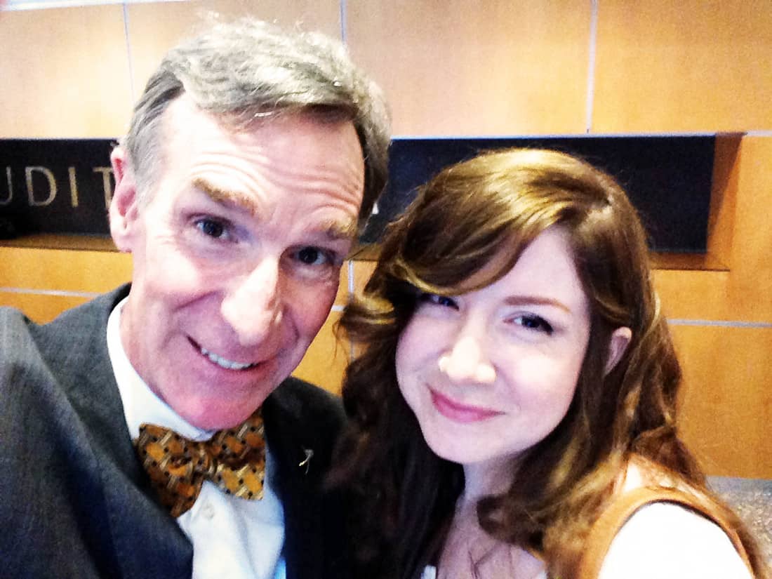 Bill Nye wearing a suit and bow and Charity Nye smiling