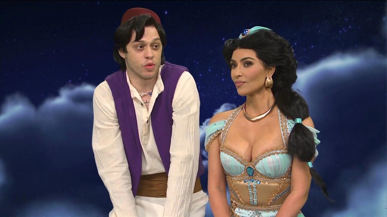 Kim Kardashian wearing a princess Jasmine costume and Pete Davidson wearing an Aladdin costume on SNL