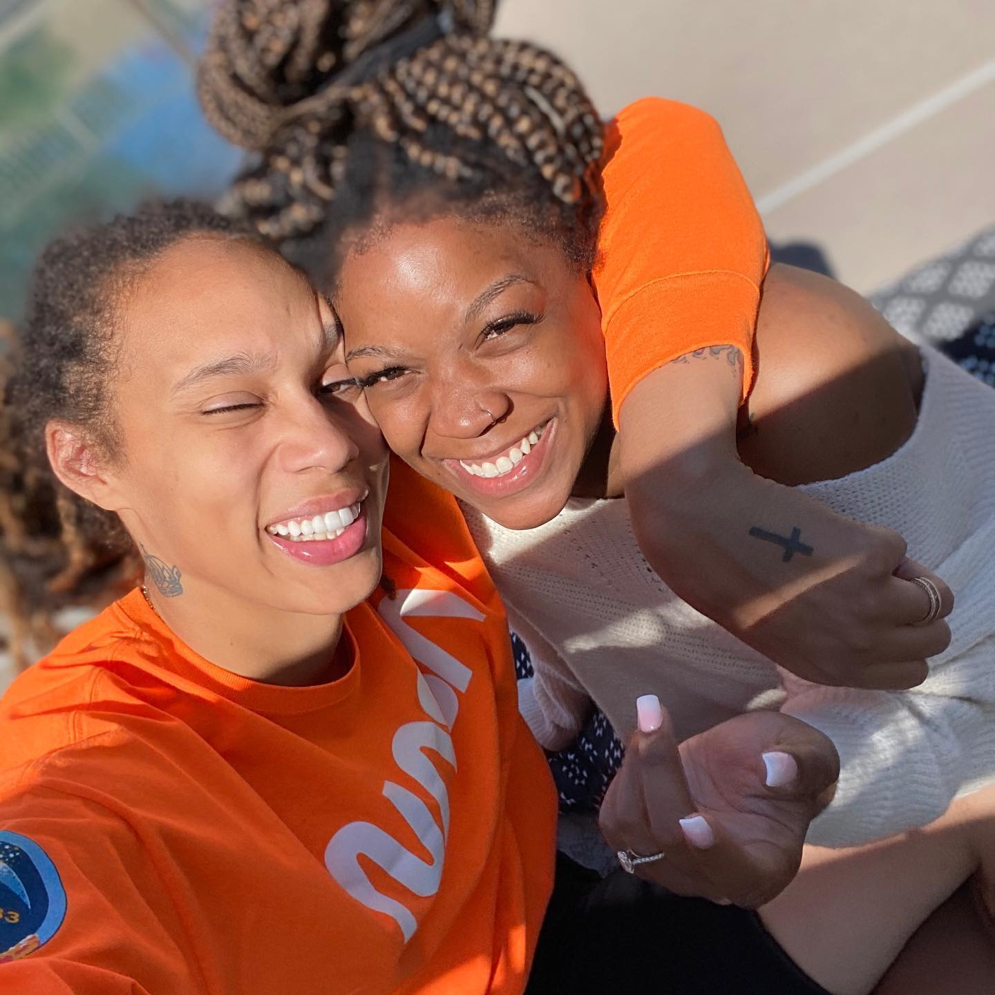 Brittney Griner and wife, Cherelle, smile broadly and closely together for the camera