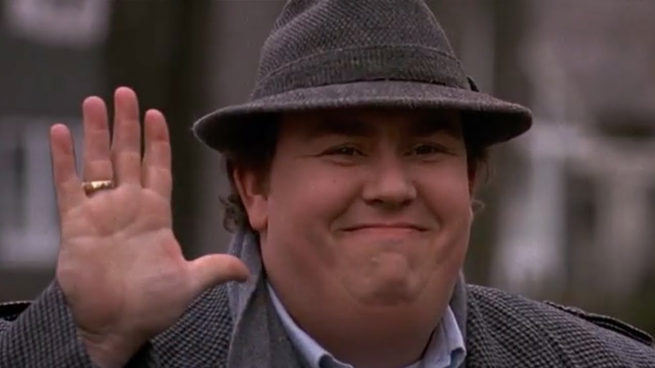John Candy Showing Waiving His Hand While Smiling