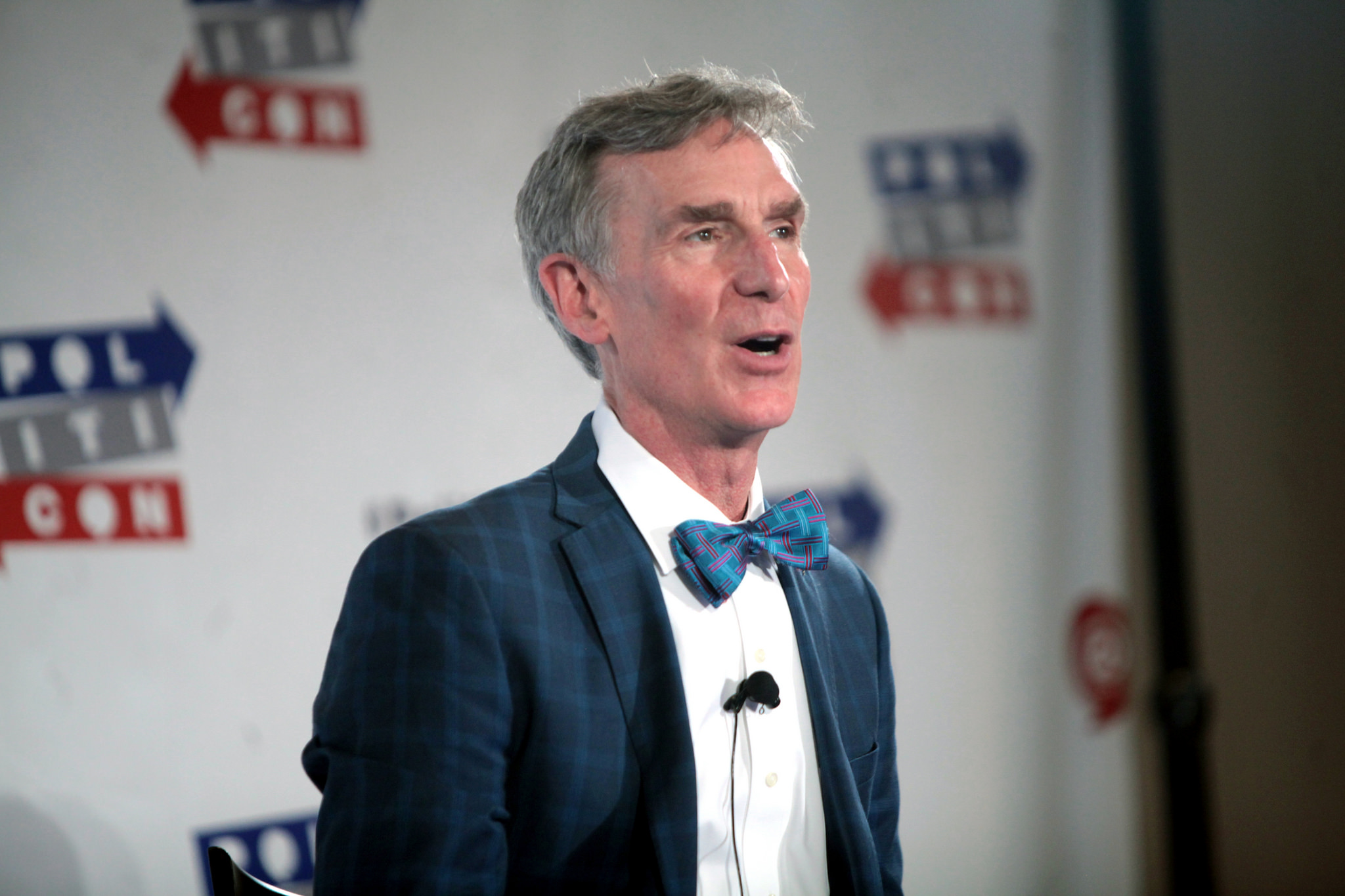 Bill Nye talking while wearing a blue suit