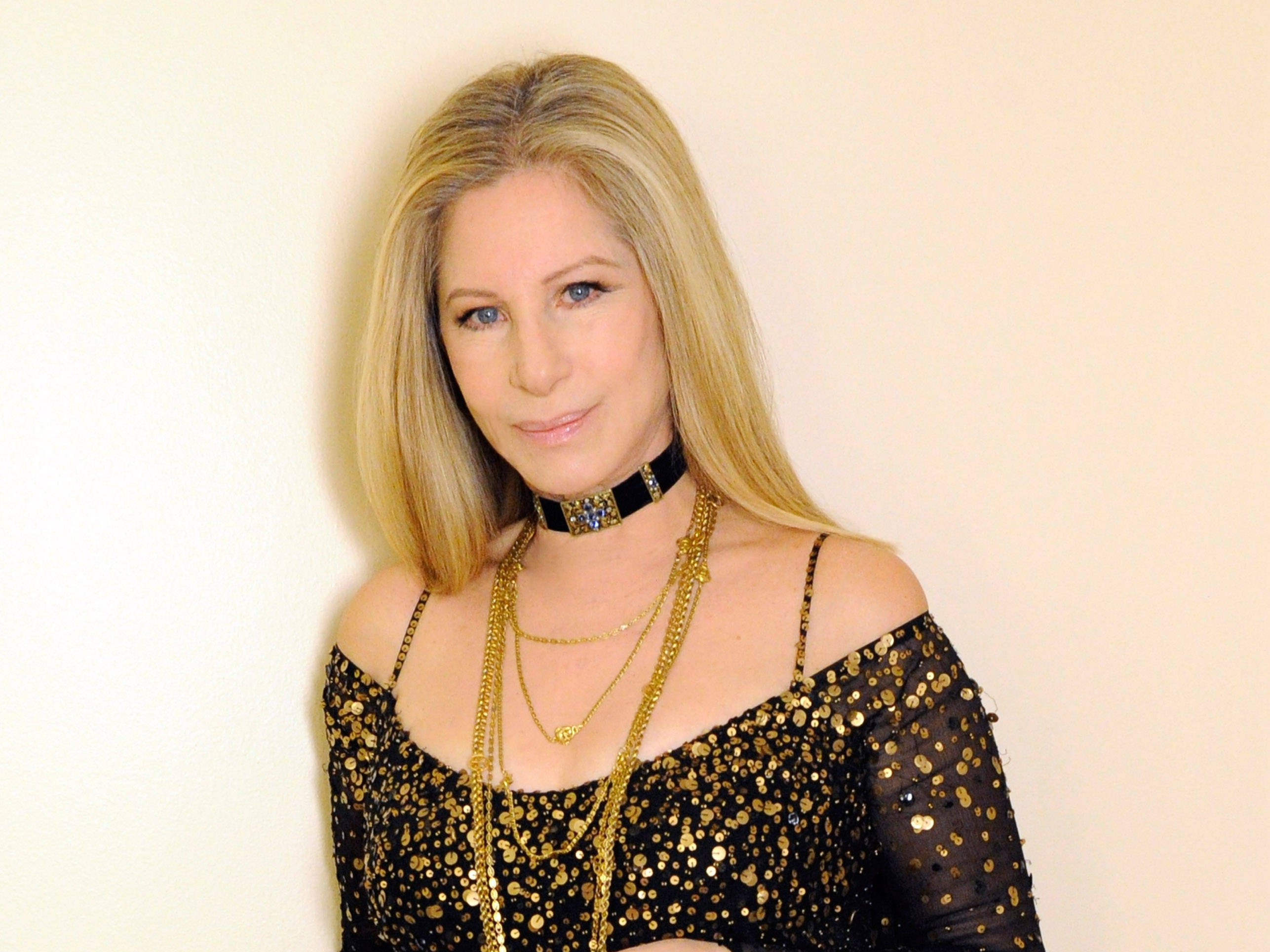 Barbra Streisand Wearing A Black Shiny Dress and choker necklace
