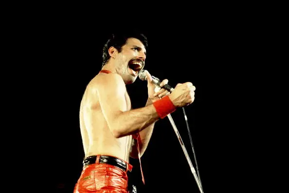 Freddie Mercury Singing on stage with shirt off