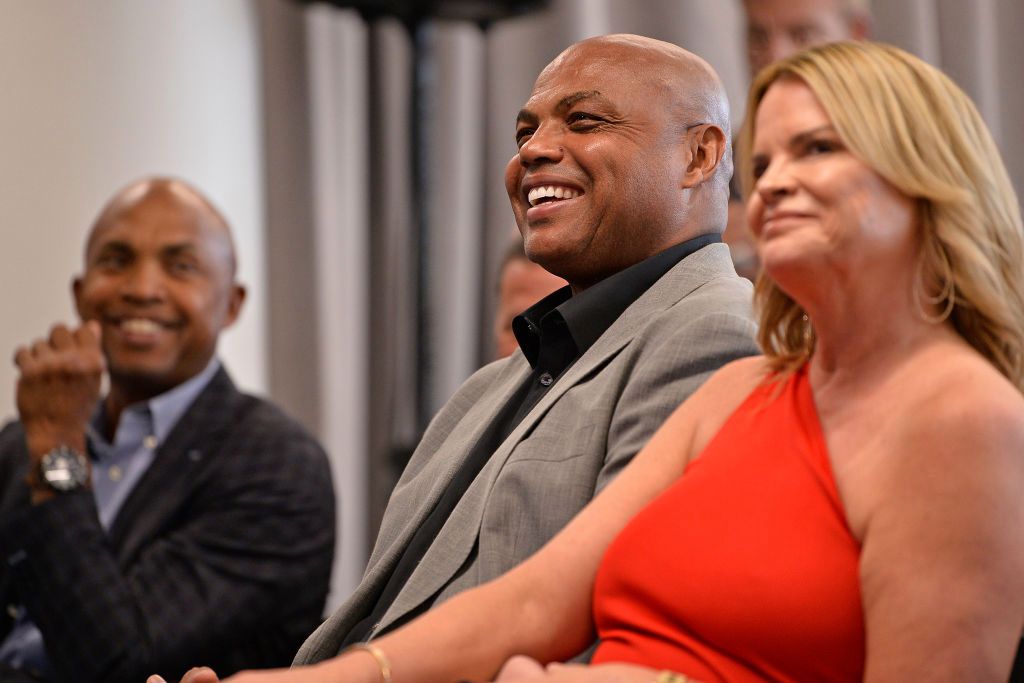 Maureen Blumhardt and Charles Barkley sitting and smiling
