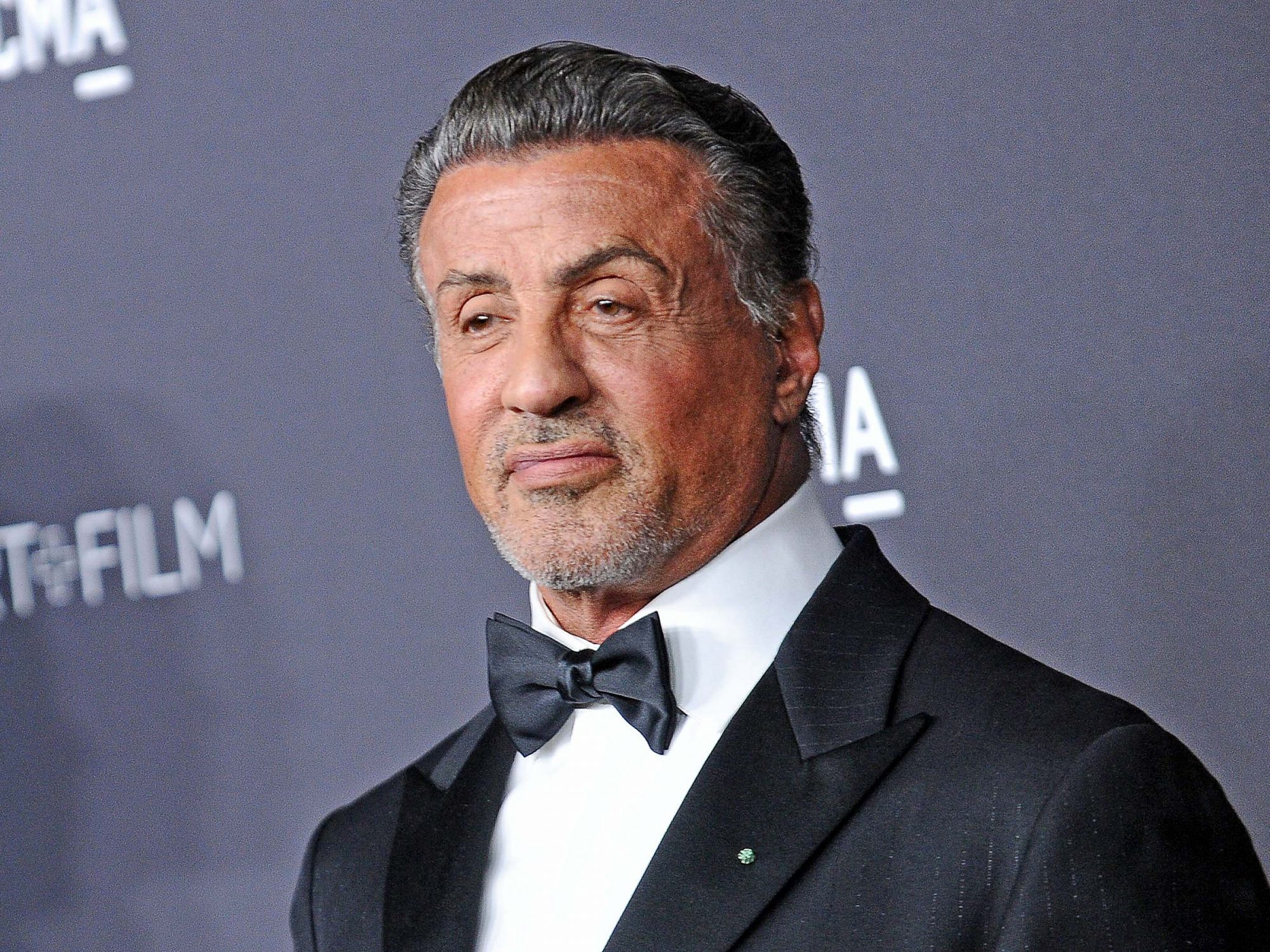 Sylvester Stallone wearing a suit