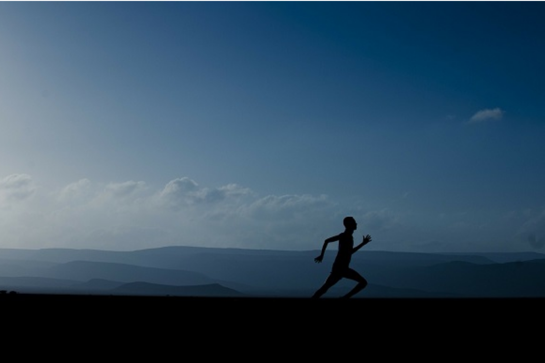 A guy running in silhouette